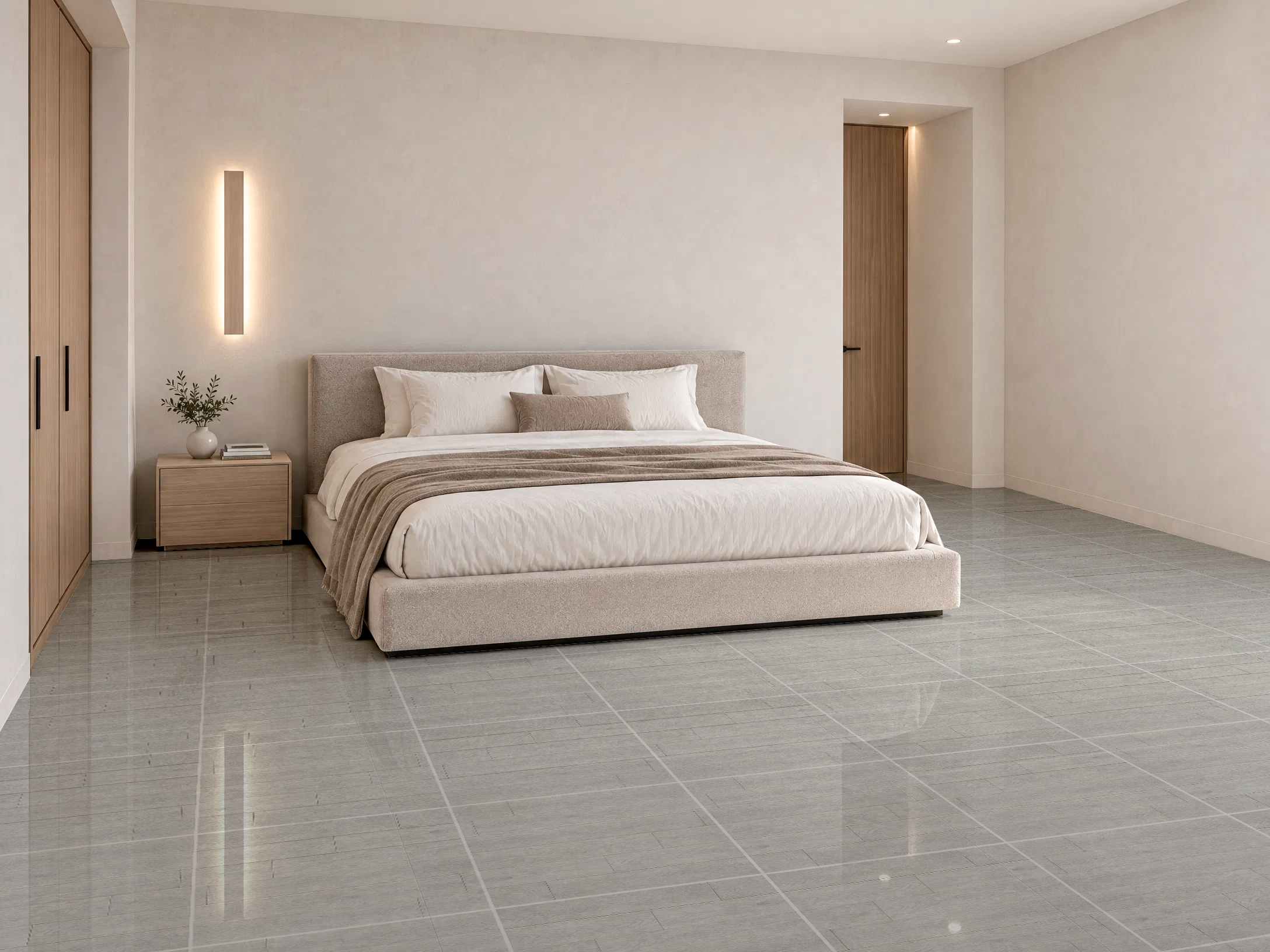 Dormitorio amplio de tonos pasteles, cama beige y piso de cerámica madera Alaska, colección Materia 46x46 de Cerámicos Gala