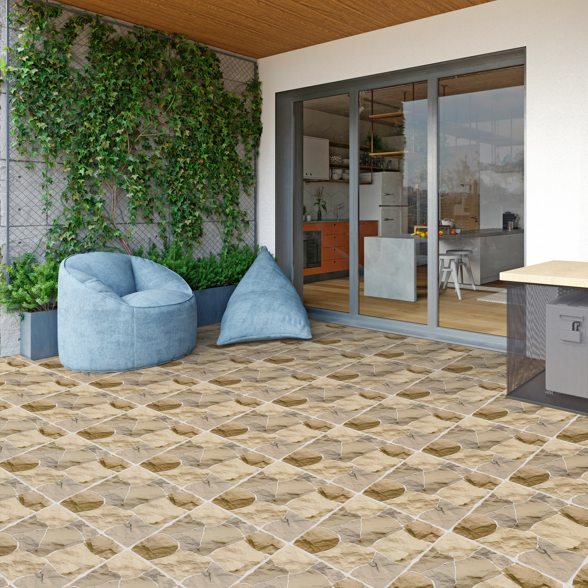 Exterior iluminado, cojines celestes, área verde, y piso de cerámica piedra Montara, colección Ecos de Cerámicos Gala